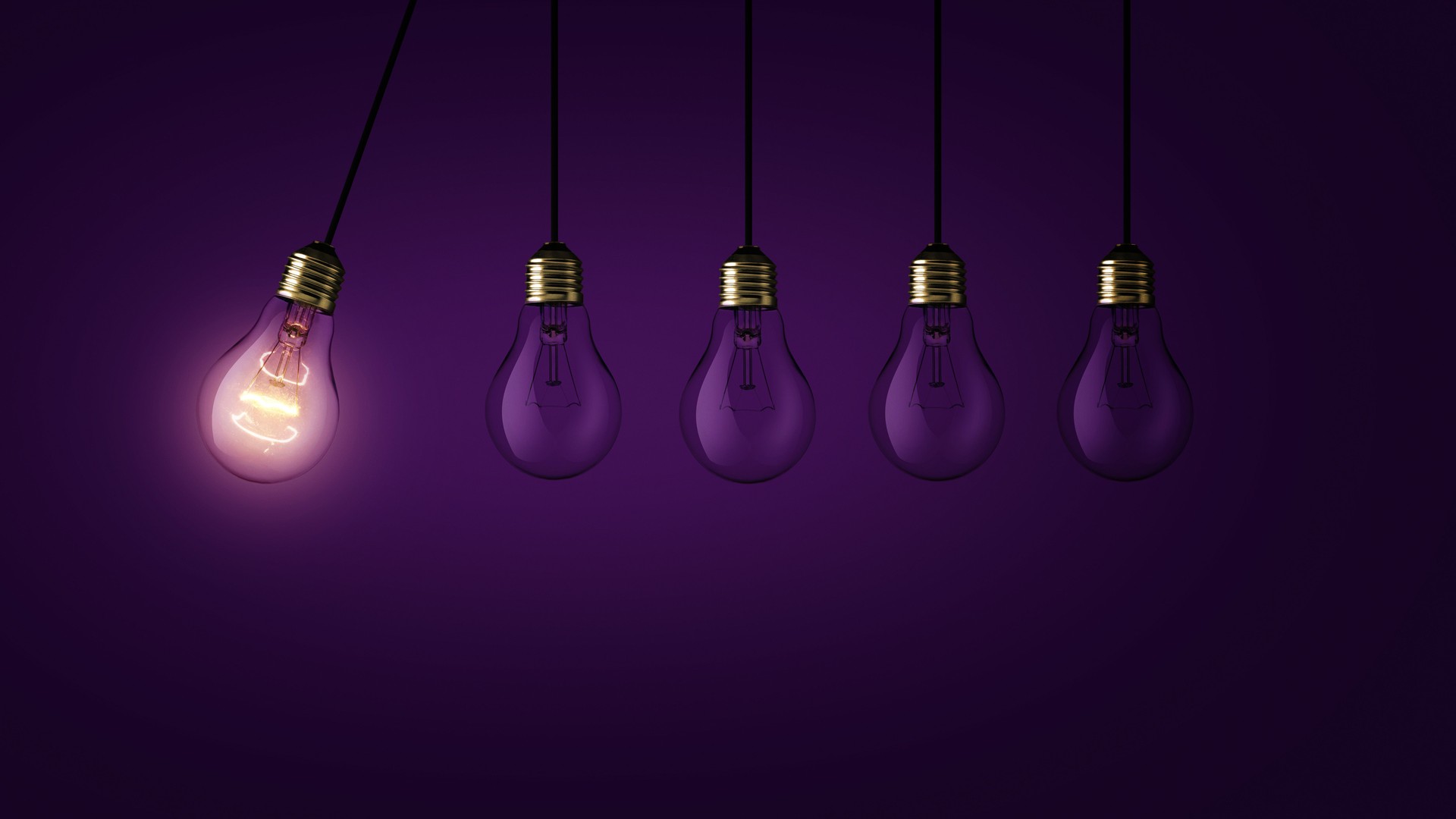 Creative light bulb lights up other extinguished light bulbs on a dark purple background, concept.  Leadership, creative idea. Think differently. Start up